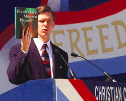 Above: Christian Coalition president Ralph Reed holds a textbook he claims is being used to teach physics in schools.